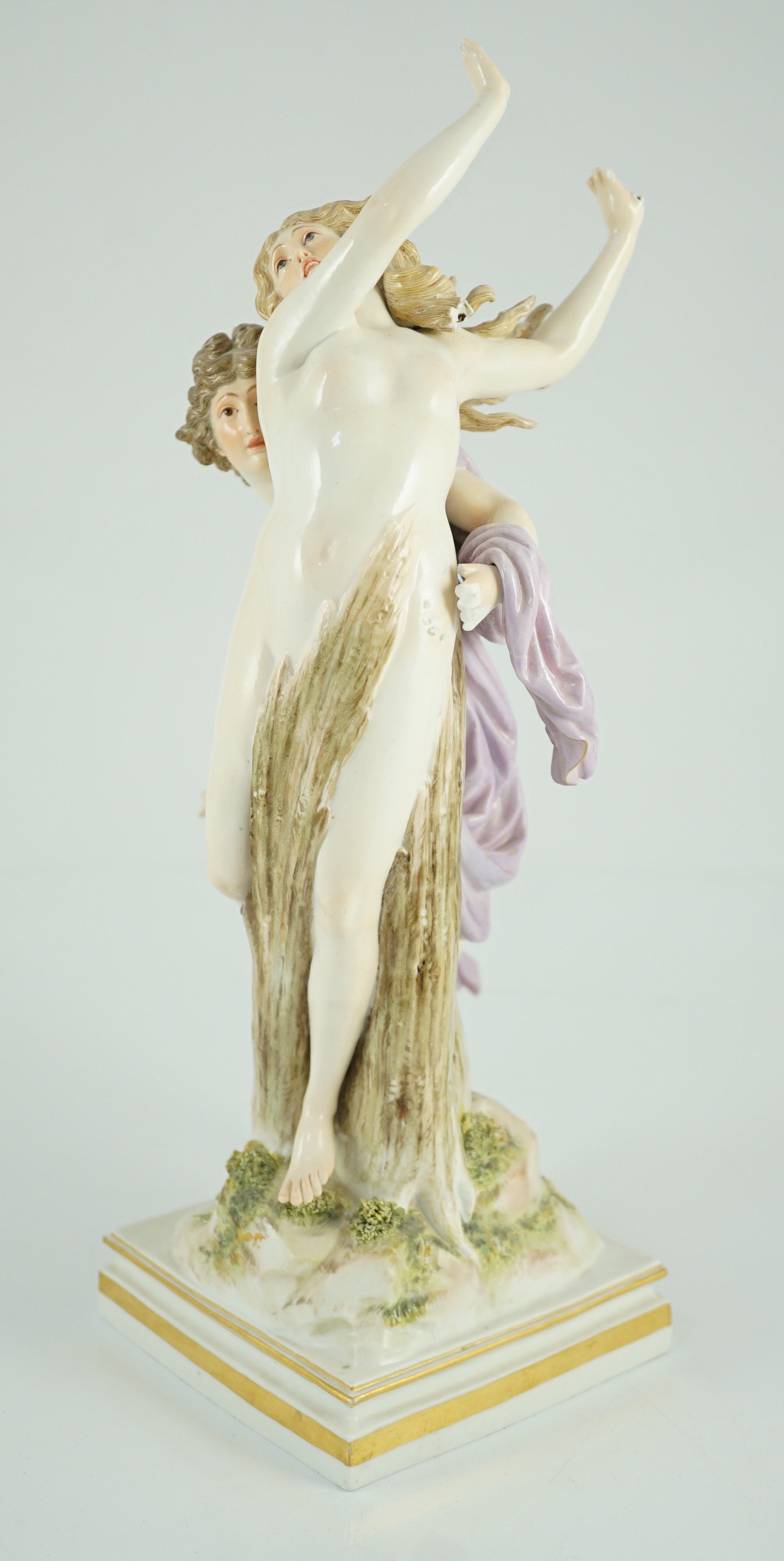 A Meissen allegorical group of Apollo and Daphne, 19th century, 36cm high, losses to hands and hair